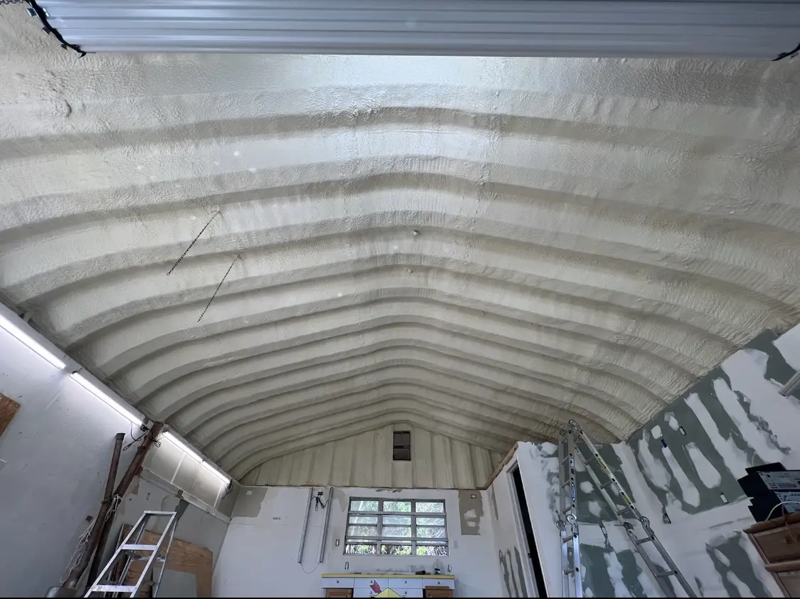 Spray polyurethane foam applied to the underside of a metal roof deck in Blue Ash